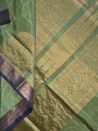 Harini – Pastel Green Handloom Kanchi Silk Cotton Saree with Blue Zari Border