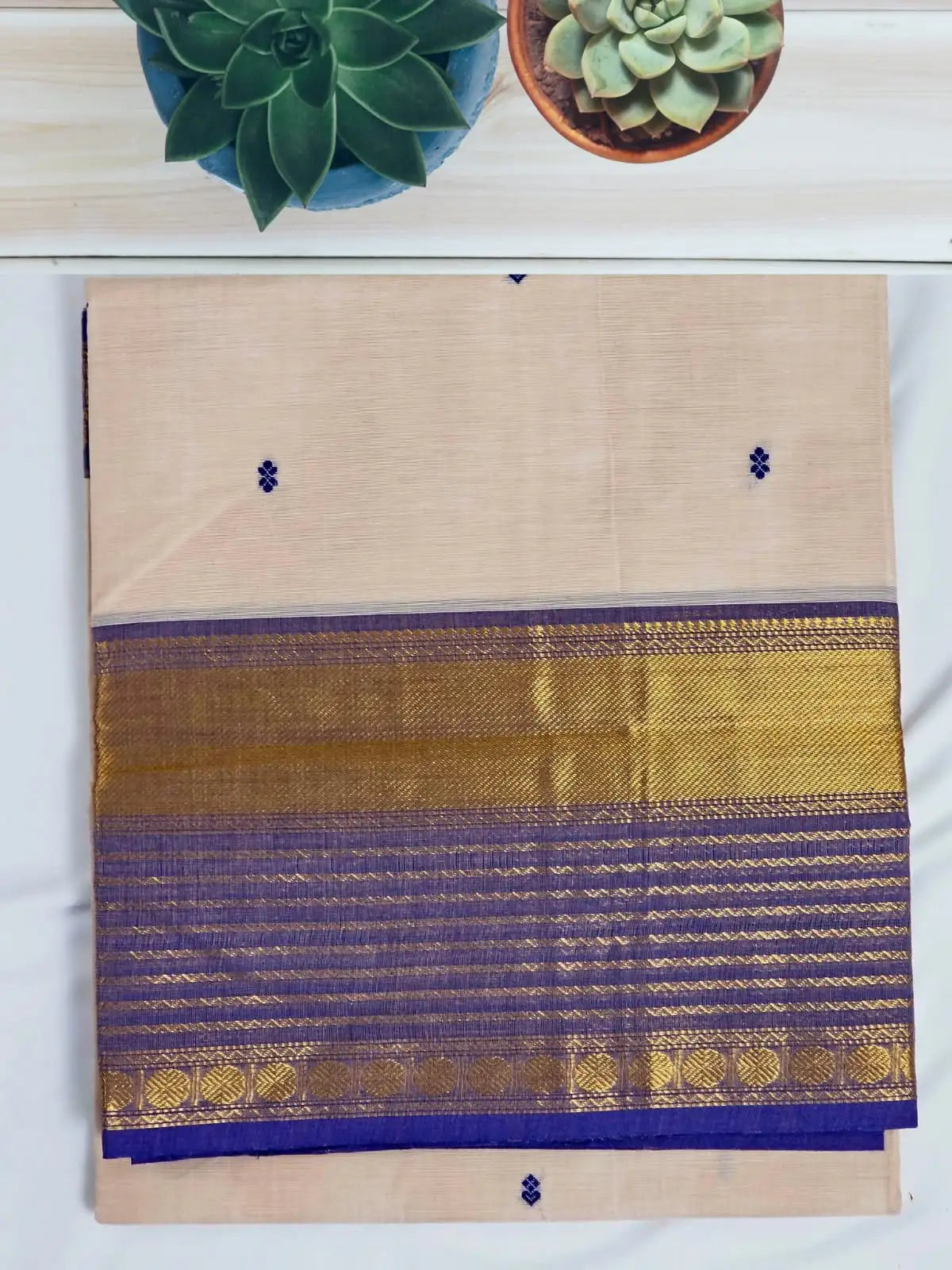 Folded Blush Pink Handloom Venkatagiri Cotton Saree with Navy Blue Zari Border