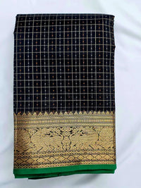 A folded Lakshadeepam Handloom Kanchi Silk Cotton Saree | Classic Black  