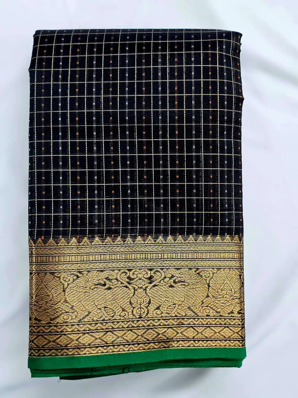 A folded Lakshadeepam Handloom Kanchi Silk Cotton Saree | Classic Black  