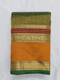 A folded Lakshadeepam Handloom Kanchi Silk Cotton Saree | Forest Green with Mustard-Rust Pallu & Temple Zari Border