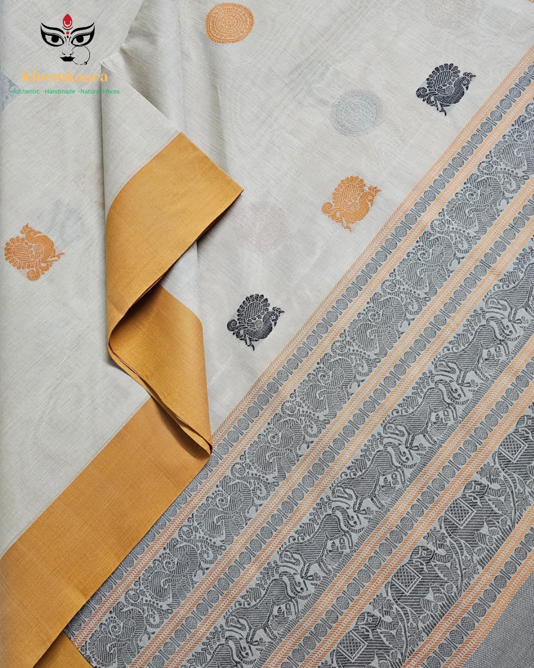 Peetambara – Off-White Handloom Kanchi Cotton Saree with Yellow Border & Peacock Motifs