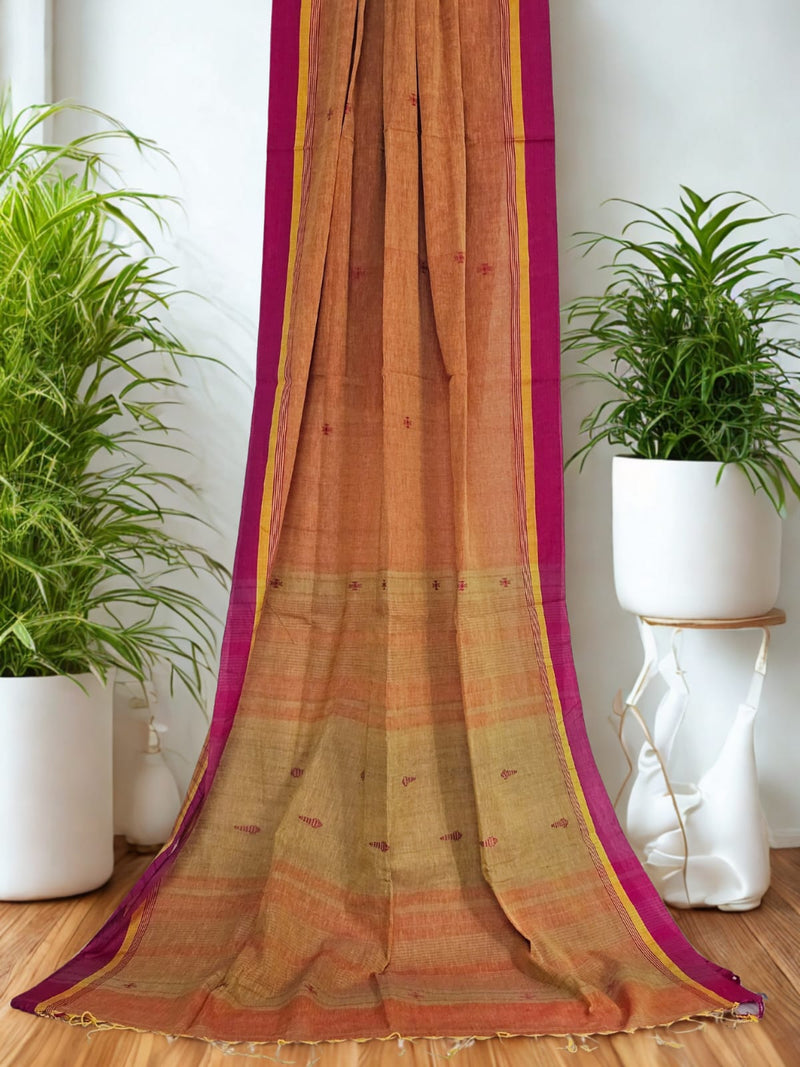Ravisha – Amber Ochre Handloom Khadi Saree with Magenta Border & Bhujodi Motifs