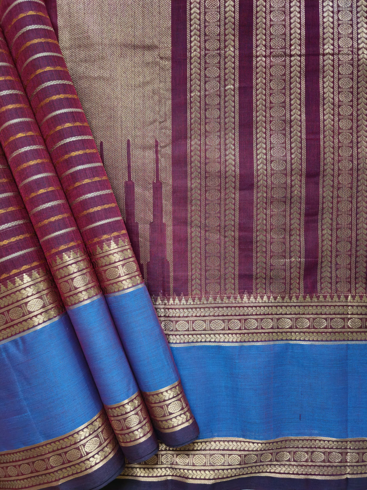 Vaigai Varninī – Maroon Handloom Kanchi Cotton Saree with Sky Blue Zari Border