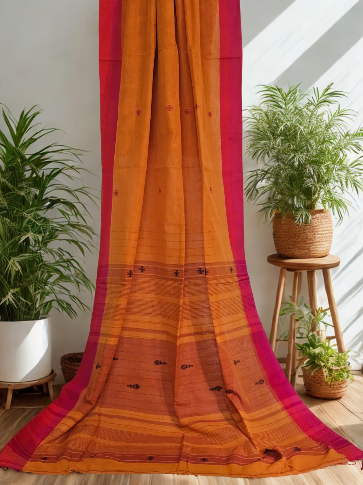 Yamika – Burnt Orange Handloom Khadi Saree with Magenta Pink Border & Bhujodi Motifs