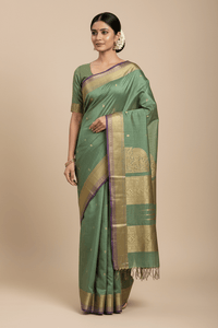 Harini – Pastel Green Handloom Kanchi Silk Cotton Saree with Blue Zari Border - Kleemkaara