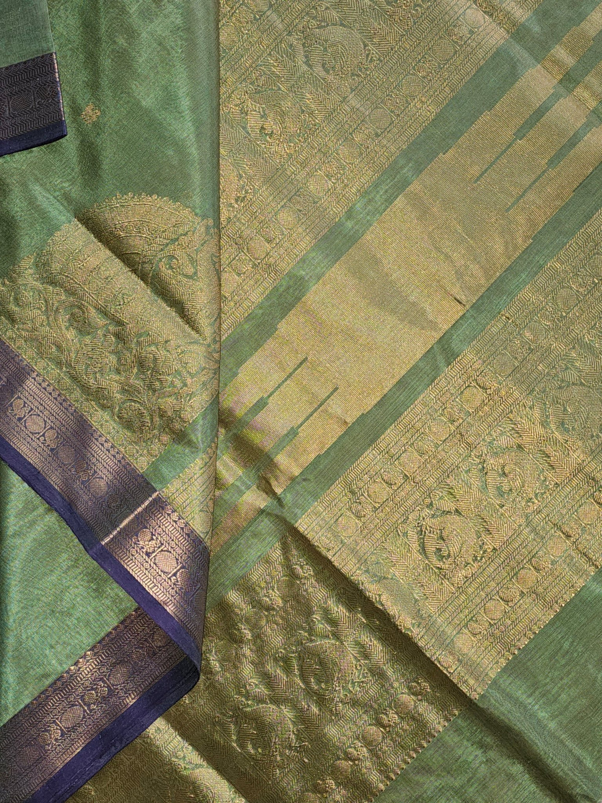 Harini – Pastel Green Handloom Kanchi Silk Cotton Saree with Blue Zari Border - Kleemkaara