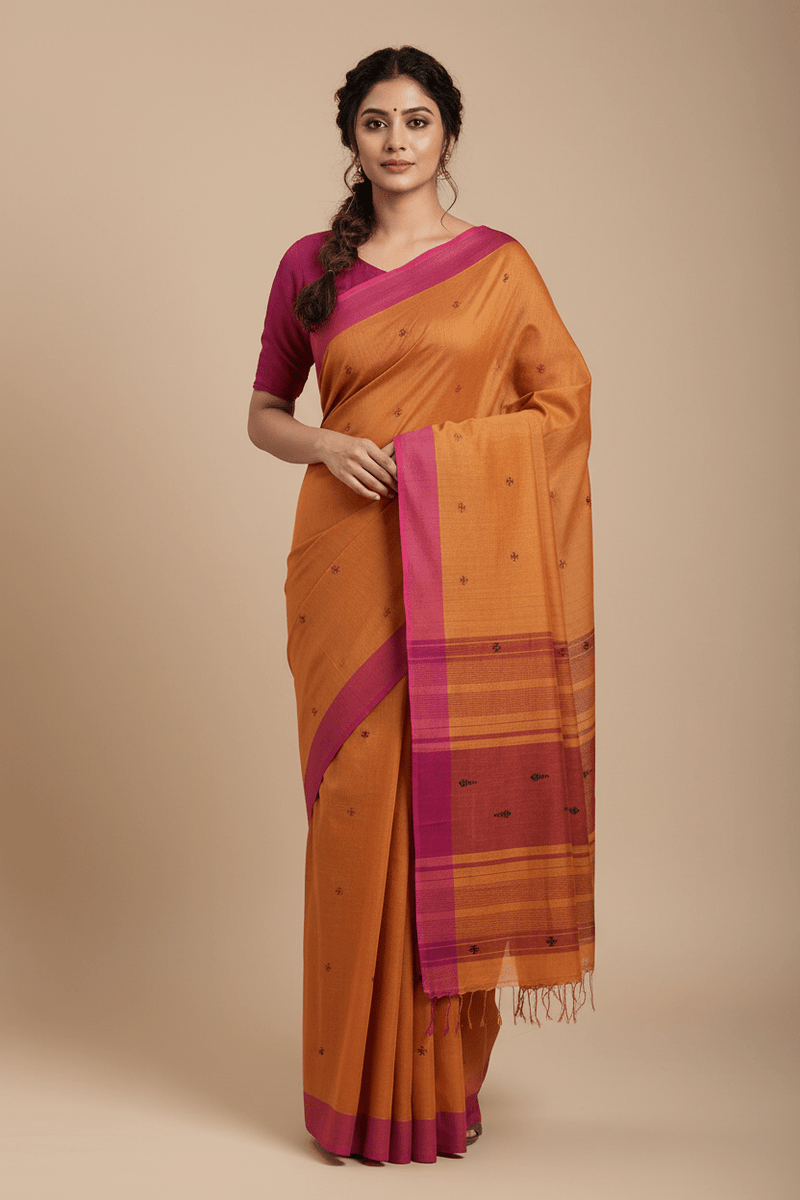 Yamika – Burnt Orange Handloom Khadi Saree with Magenta Pink Border & Bhujodi Motifs - Kleemkaara